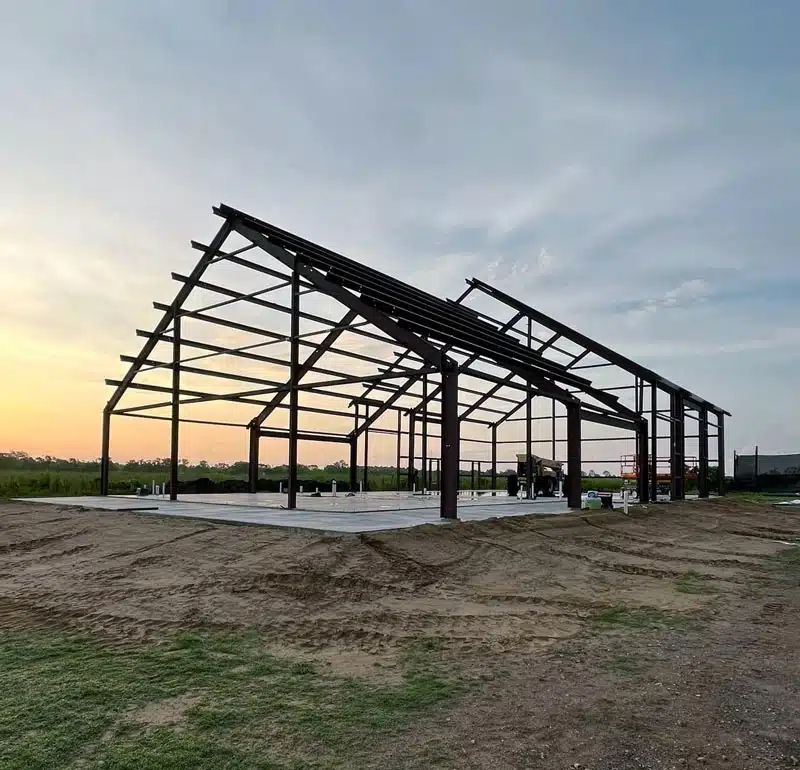 Barndominium frame at sunset in Missouri